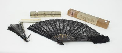 Lot 940 - A faux mother-of-pearl fan, the fitted box...