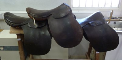 Lot 960 - Three leather saddles various and a pine...