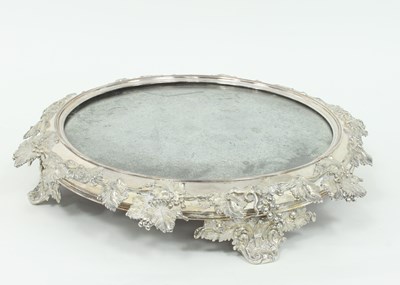 Lot 995 - A circular plated mirror based cake stand with...