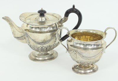 Lot 1067 - A silver teapot and sugar basin, Charles...