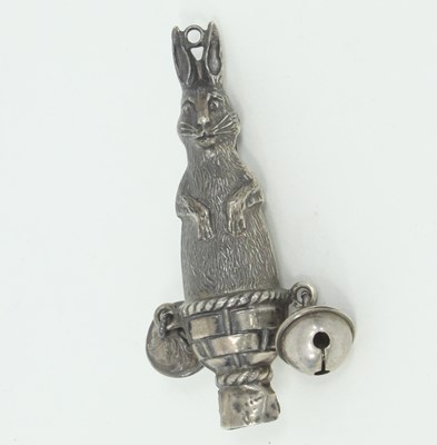 Lot 1080 - A late 19th century silver rabbit teether,...