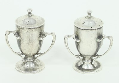 Lot 1085 - A pair of Arts and Crafts silver three-handled...