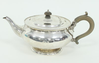 Lot 1090 - A silver circular teapot, W N Ltd., Birmingham...