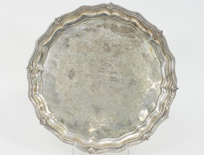 Lot 1100 - A silver salver, marks rubbed, inscribed...