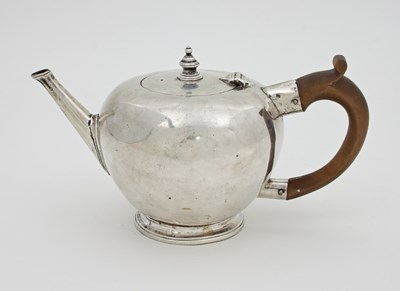 Lot 1118 - A George I silver teapot, 1724, of ovoid shape,...