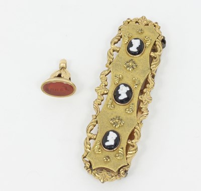 Lot 1146 - A Victorian gilt metal buckle set with cameo...