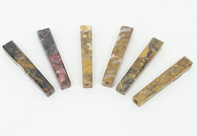 Lot 1147 - Six agate knife handles, 8.5cm long