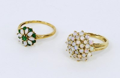 Lot 1196 - An opal petal ring and another set with opals...