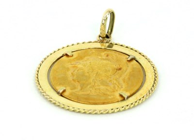 Lot 1223 - A gold medallion pendant, the circular plaque...