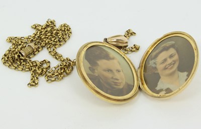 Lot 1230 - A Victorian gold and gem set locket, the oval...