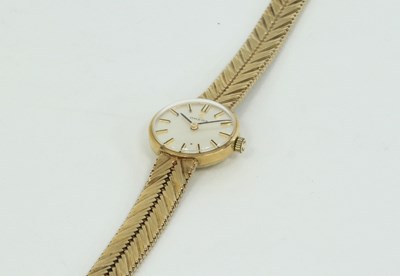 Lot 1232 - A lady's 9ct gold wristwatch, by Omega, the...