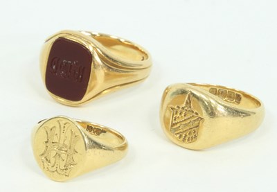 Lot 1236 - Three gentlemen's 18ct gold signet rings, one...