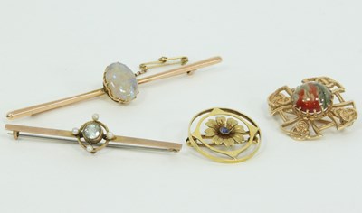 Lot 1237 - A collection of four brooches, including an...