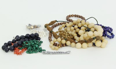 Lot 1239 - A collection of beads including lapis lazuli,...