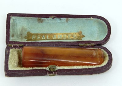 Lot 1245 - An amber cheroot holder, in fitted case marked...