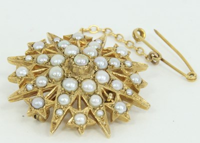 Lot 1248 - A split pearl starburst brooch set in 9ct gold...