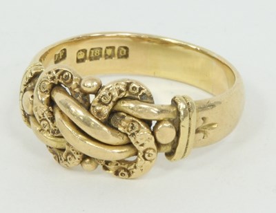 Lot 1277 - An 18ct gold ring, with knot of rope design,...