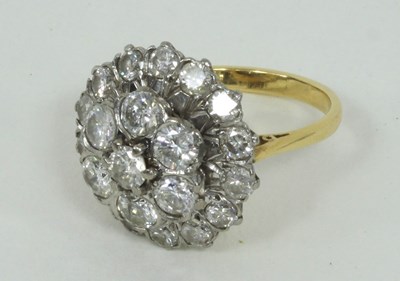 Lot 1279 - A diamond flowerhead ring, the central cluster...