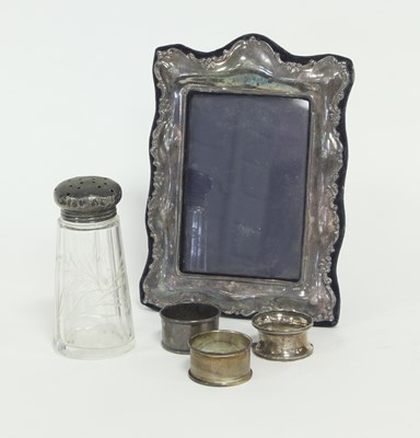 Lot 228 - A modern silver photograph frame of scrolling...