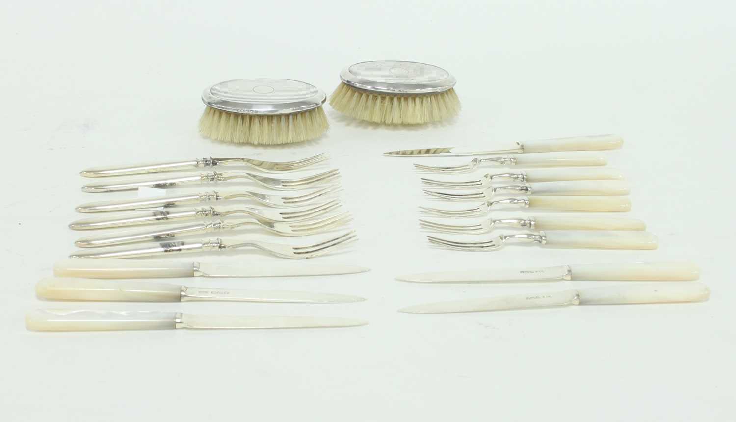 Lot 270 - A set of six silver fruit knives and forks...
