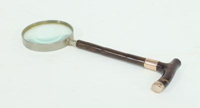 Lot 323 - A magnifying glass with faux tortoiseshell...