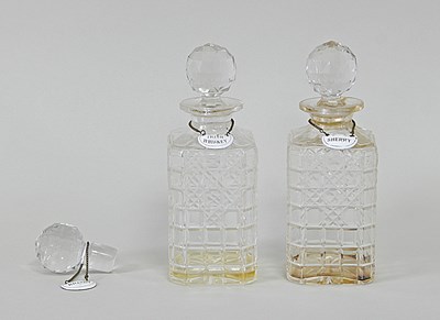 Lot 338 - A pair of cut glass decanters and stoppers, an...