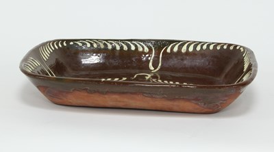 Lot 366 - An 18th Century rectangular slipware dish,...