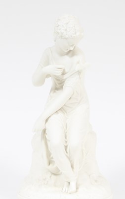 Lot 369 - A parian figure of a young lady with a bird,...