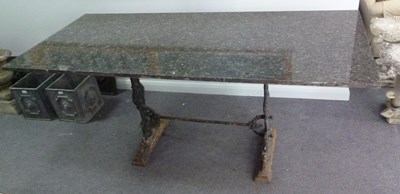 Lot 500 - An iron garden table with marble top, 172cm long