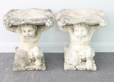 Lot 510 - A pair of reconstituted stone seats, modelled...