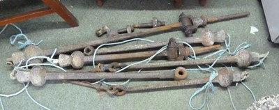 Lot 516 - Six iron bell clappers of graduated sizes, ex...