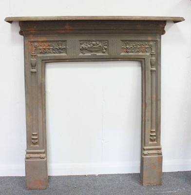 Lot 541 - A cast iron fire surround, cast with urn of fruit