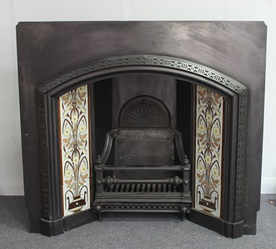 Lot 542 - A very large cast fireplace with floral Minton...