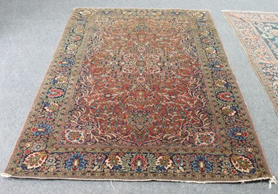 Lot 572 - A Kashan rug, the central medallion on a...