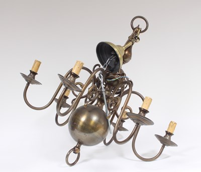 Lot 587 - A Dutch oxidised brass eight-light chandelier...