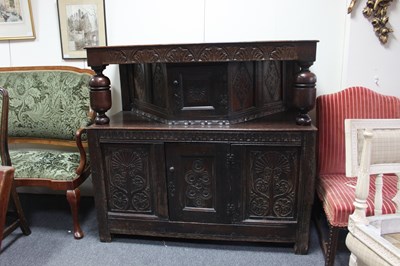 Lot 589 - A 17th Century style oak court cupboard with...