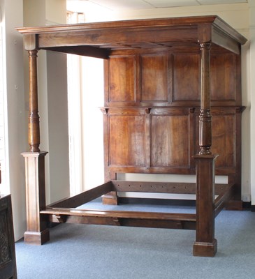 Lot 593 - A modern oak four-poster bed frame with...