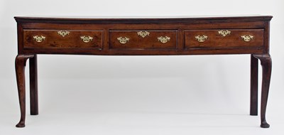 Lot 614 - An 18th Century elm and fruitwood three-drawer...