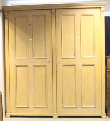 Lot 615 - A 19th Century pine panelled wardrobe, 210cm...