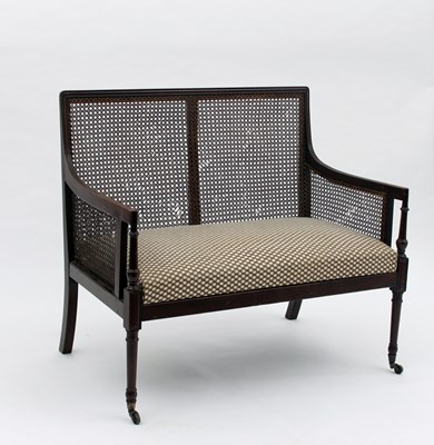 Lot 617 - A George III mahogany two-seater bergere...