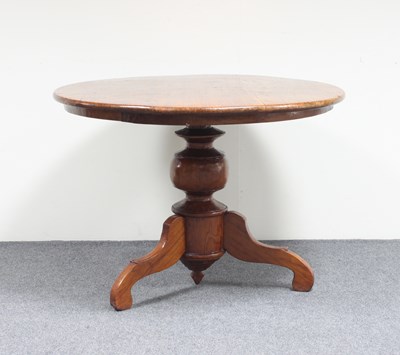 Lot 621 - A circular topped table on central column with...