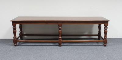 Lot 622 - A coffee table on six turned legs, 198cm long...