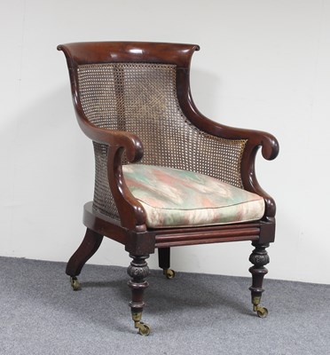 Lot 628 - A George IV mahogany bergere armchair, on...