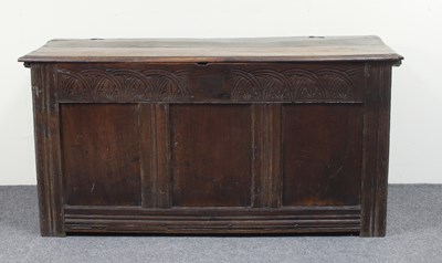 Lot 630 - A 17th Century oak coffer with plank top, the...