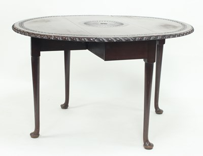 Lot 658 - A George II red walnut table, carved a central...