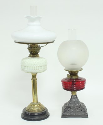 Lot 666 - A late 19th Century glass oil lamp with...