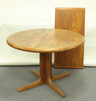 Lot 672 - A circular G Plan table on square supports and...