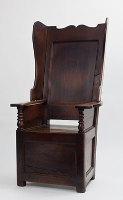 Lot 673 - 18th Century oak wingback chair with shaped...