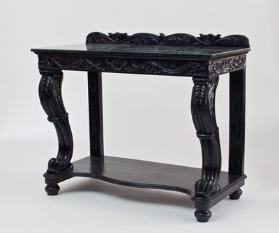 Lot 677 - A late Regency ebonised console table with...