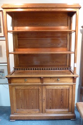 Lot 685 - A pine dresser with open shelves over with...